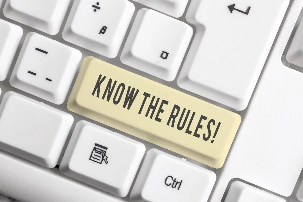 Printed text "know the rules" on a white keyboard key cap