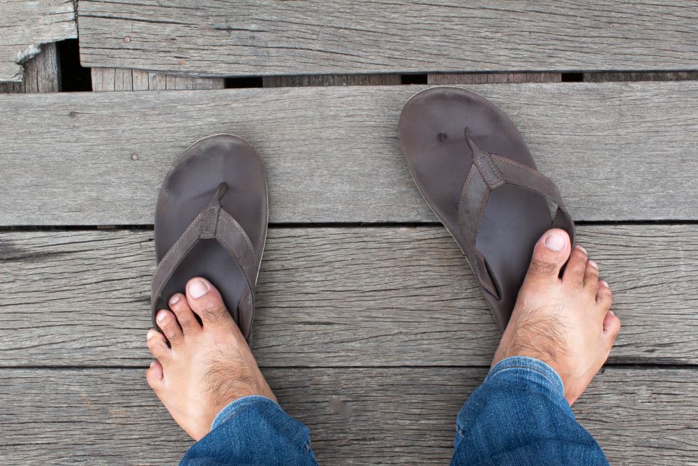 Barefoot on broken or loose wooden floor boards