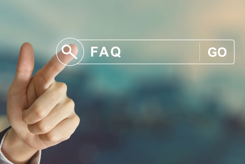 Business hand clicking FAQ or Frequently asked Questions on the search tab