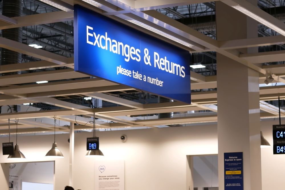 Close up exchanges and returns sign inside Ikea store