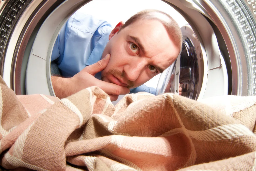 man portrait from inside of washing machine
dryer water
