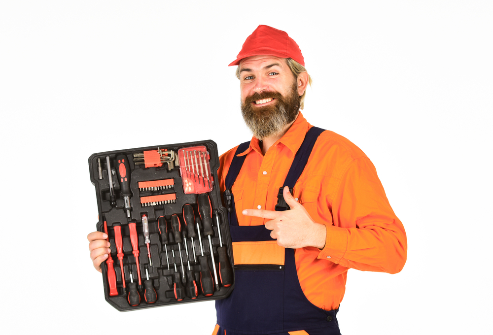 Handyman concept. Screwdrivers set. Man carries toolbox white background. Worker repairman handyman carrying toolbox. Electrician tools. Furniture makers design and craft individual pieces furniture. allen wrench