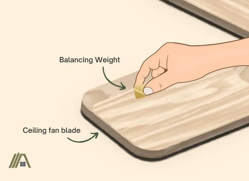 illustration of hand sticking a balancing weight in the blade of a ceiling fan