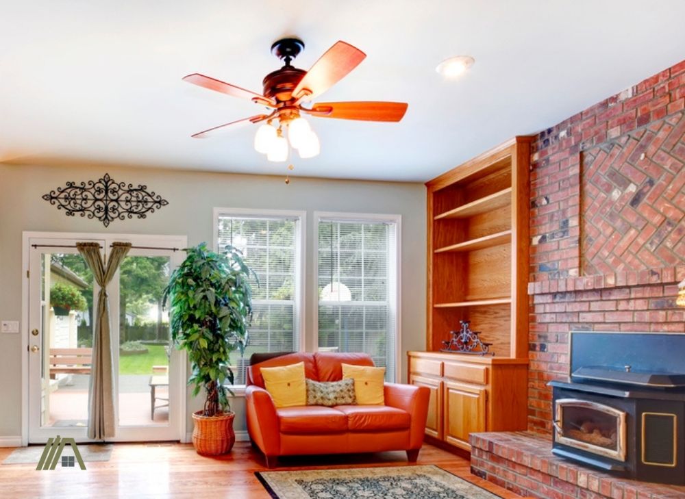 Living room with a ceiling fan and fire place