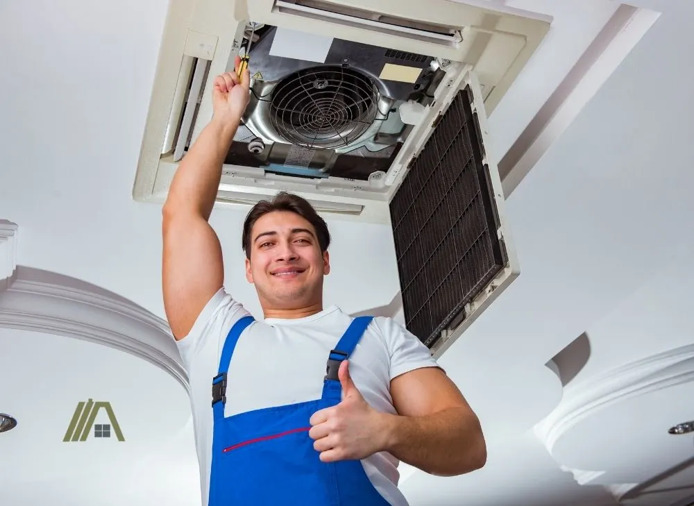 repairman giving thumbs up, cleaning HVAC_air condition system