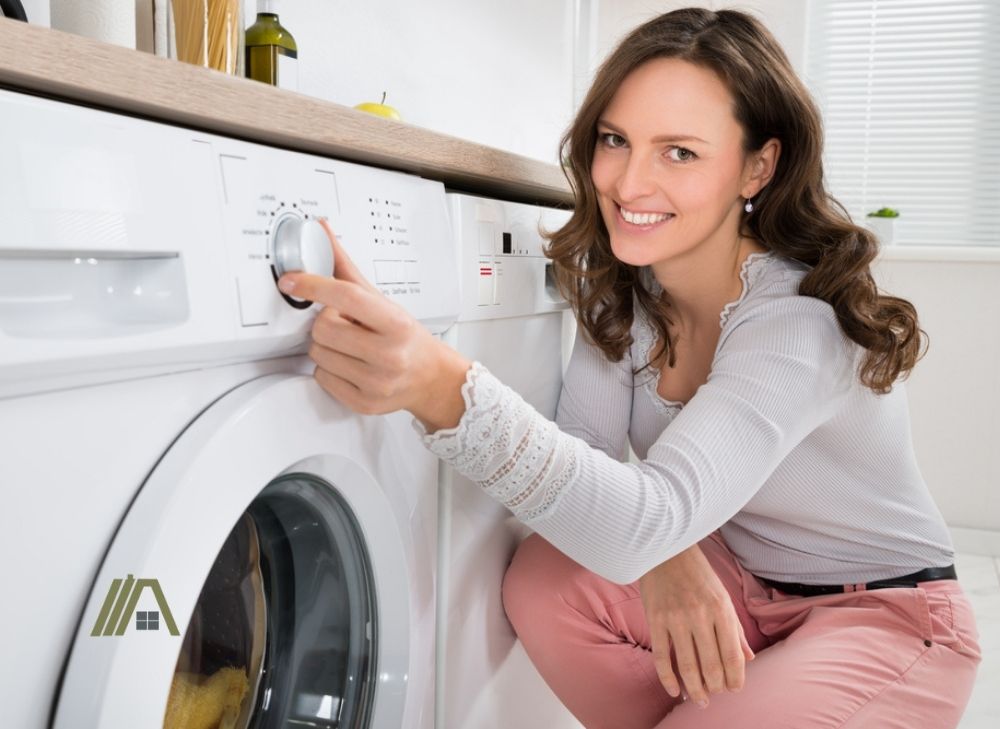 woman pressing the button of dryer