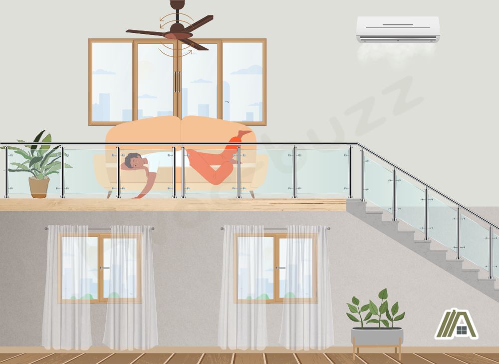 Man lying down in a sofa at the loft with the ac and ceiling fan on