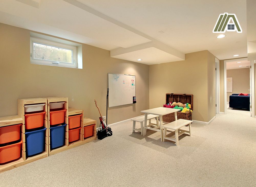Basement turned children's area with a basement window