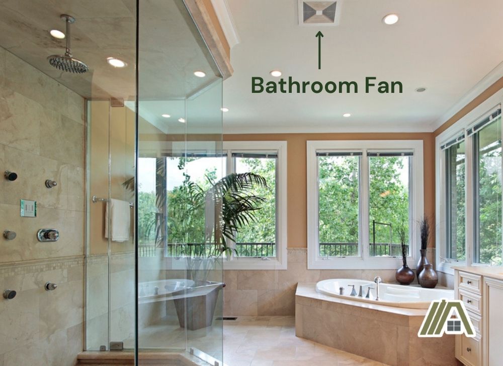 Bathroom with bathtub, enclosed shower, many windows and with marble floors and walls