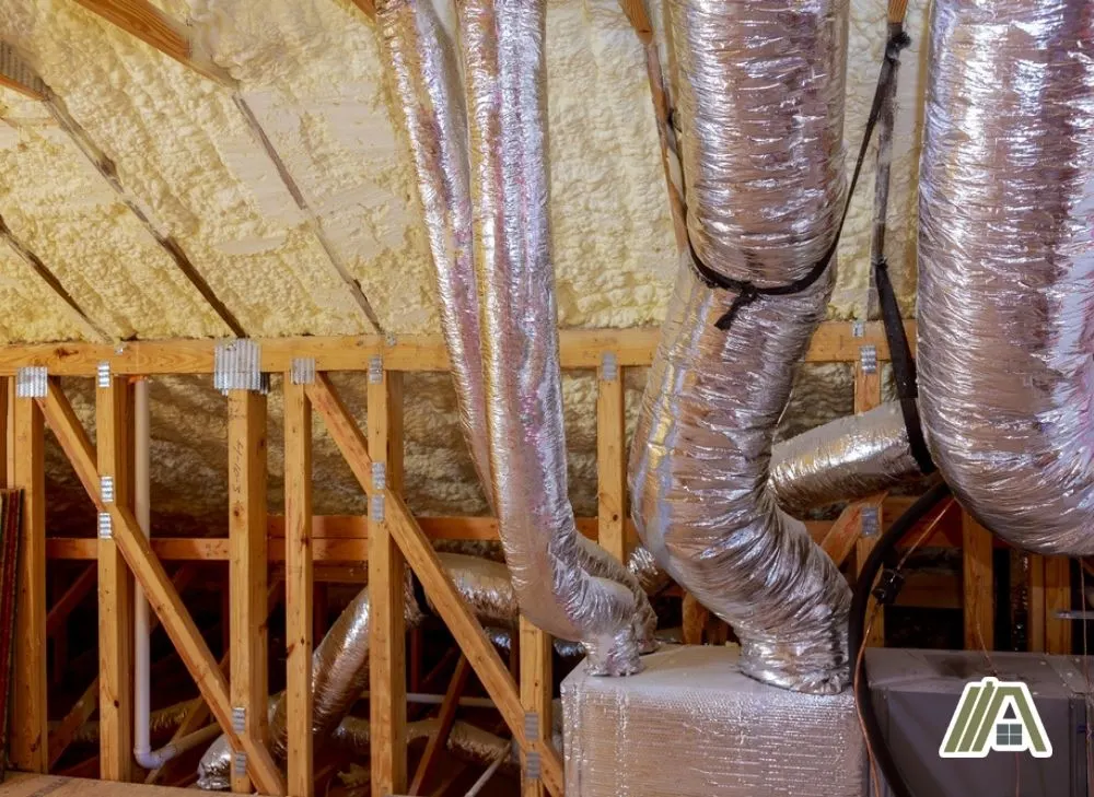 Flexible ducts installed in the attic with spray foam insulation