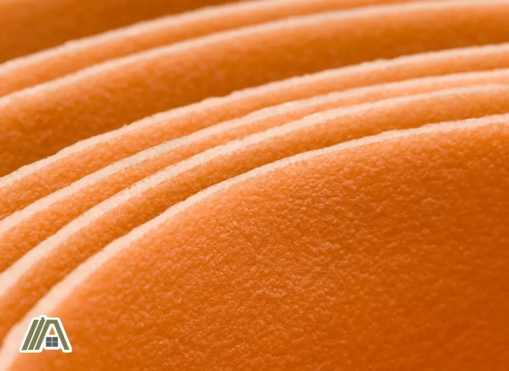 Orange plastic insulation roll