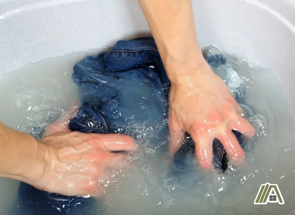 Woman hand washing jeans