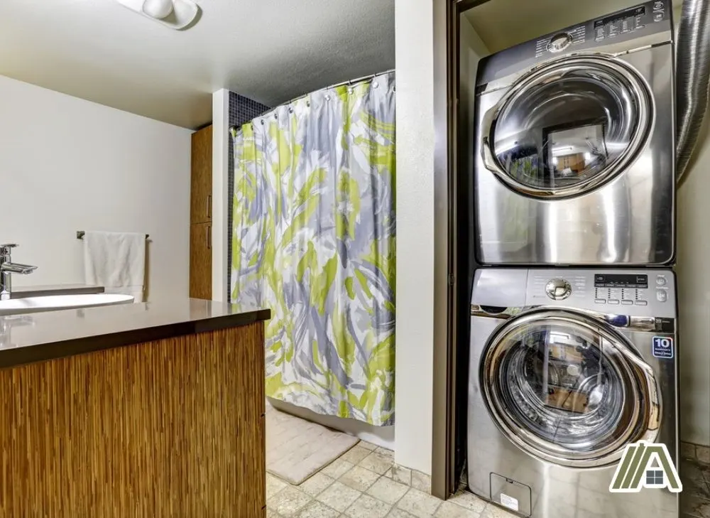 Stacked steel dryer and washer in the laundry room