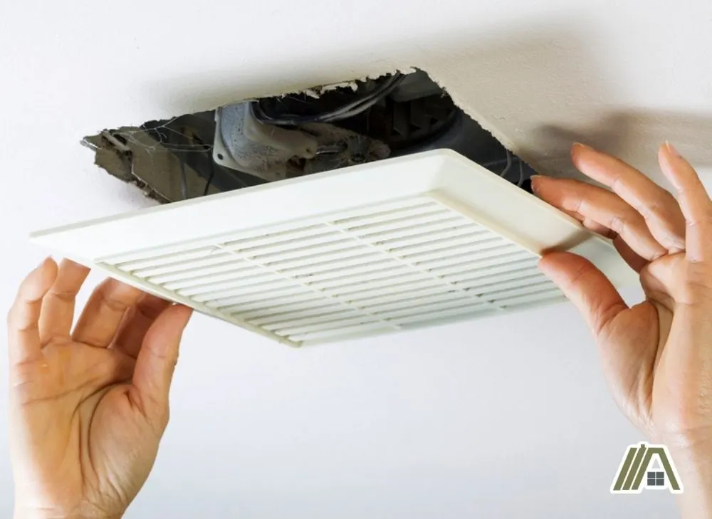 Removing-the-grill-cover-of-a-bathroom-fan-