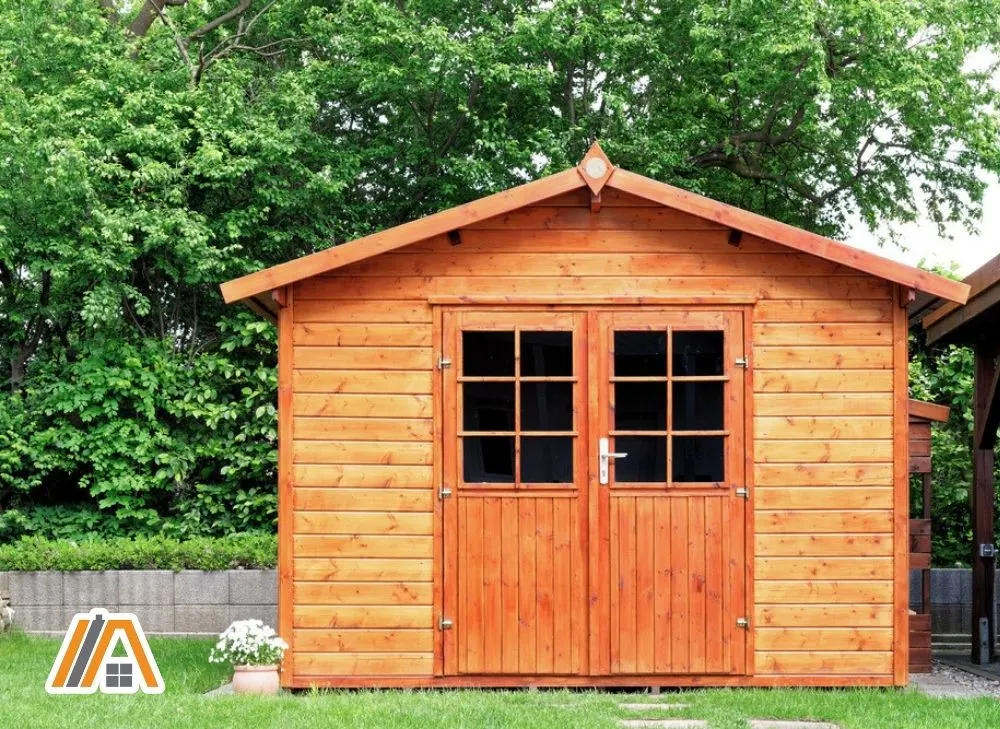 Gable roof shed made of wood with two swing doors