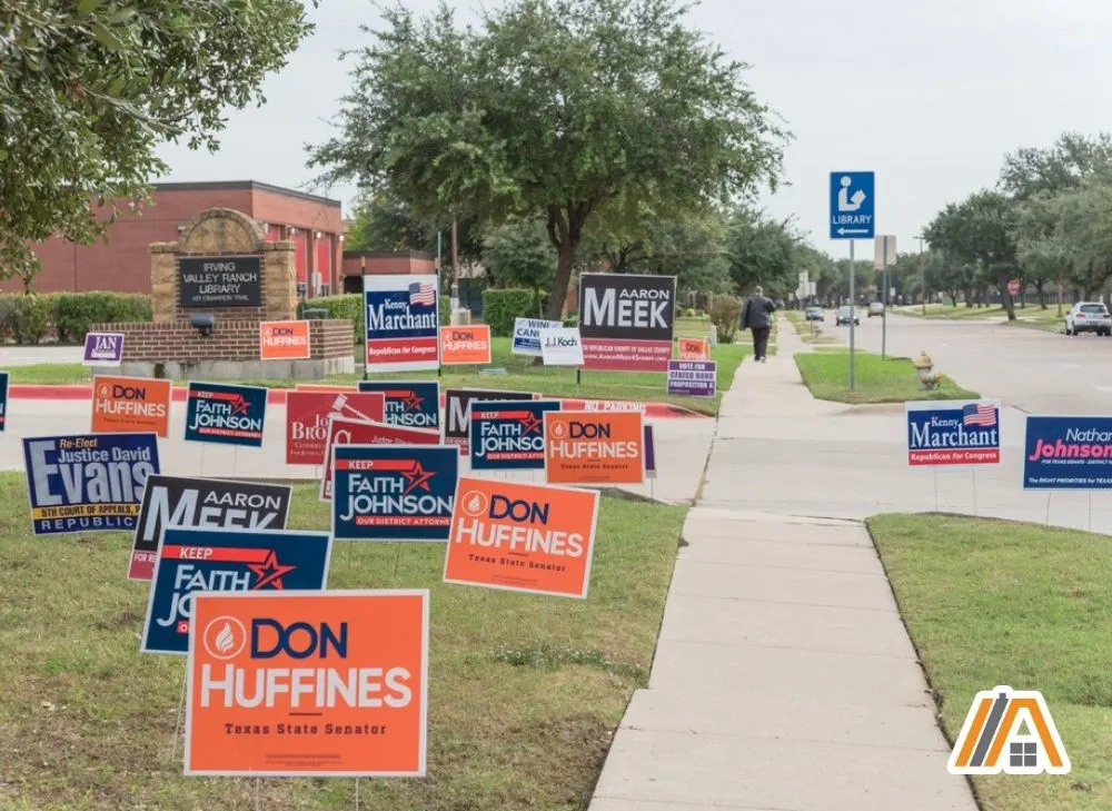 Campaign signs in front of a library