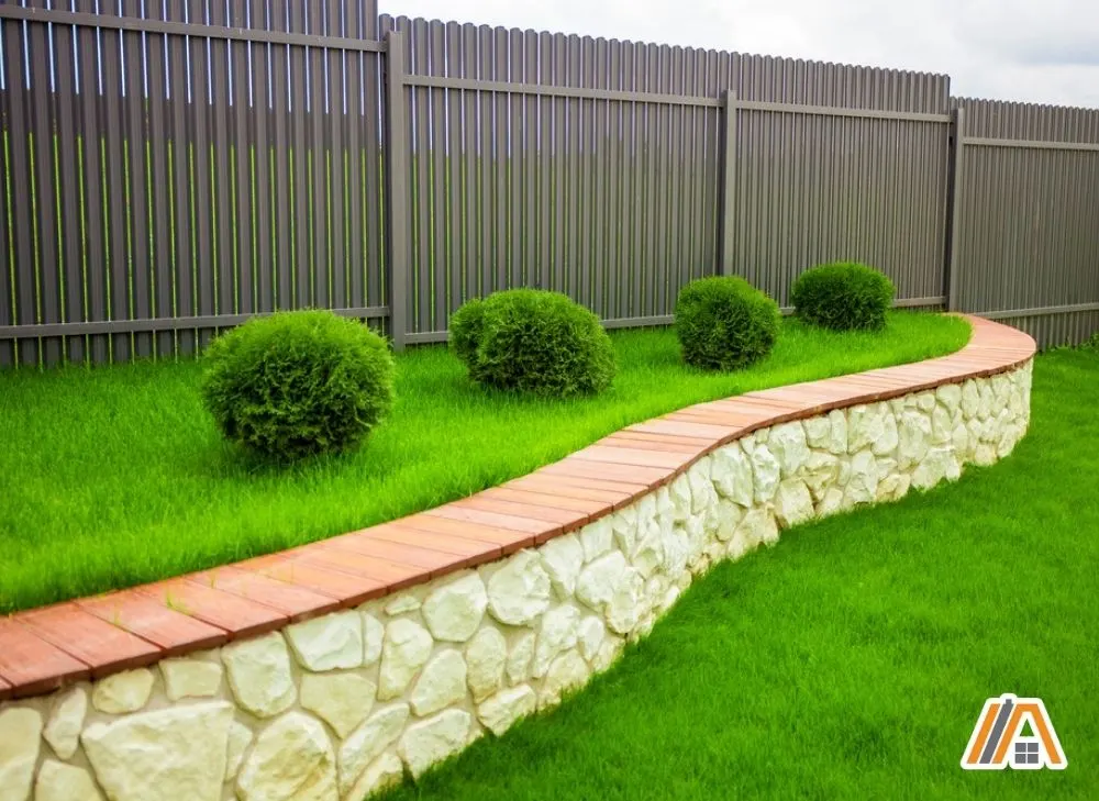 Garden with gray fence and landscaping