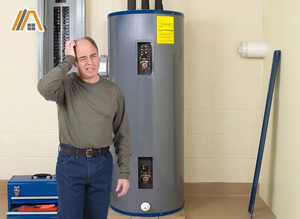 Old man wondering and a big water heater behind him beside an electric breaker