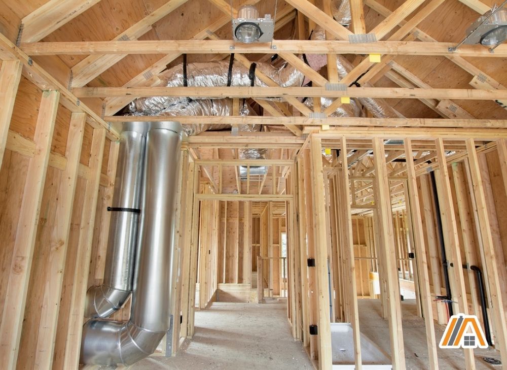 Ductwork in a residential, wooden house frame with HVAC ducts