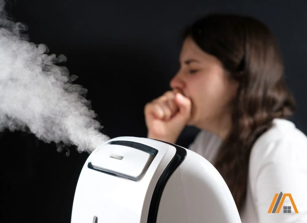 Woman coughing and a humidifier