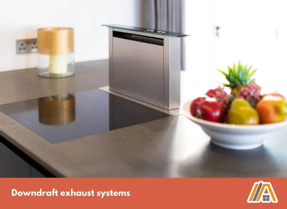 Modern Downdraft exhaust systems on a induction stove with a bowl of fruits on the side.jpg