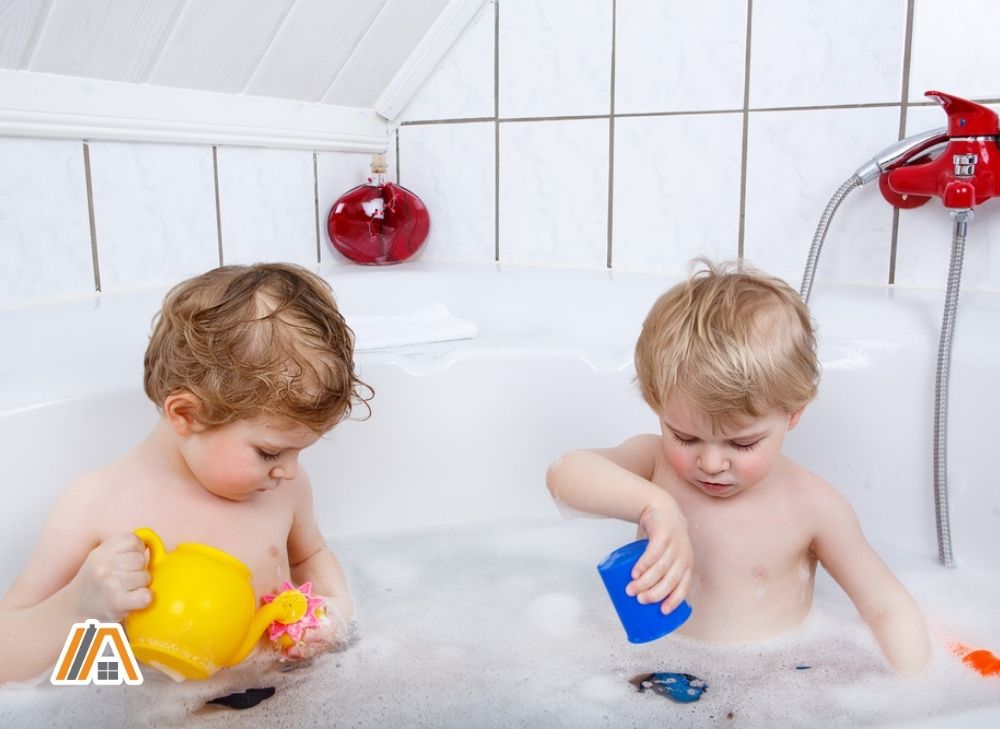 Two kids playing in the bathtub.jpg