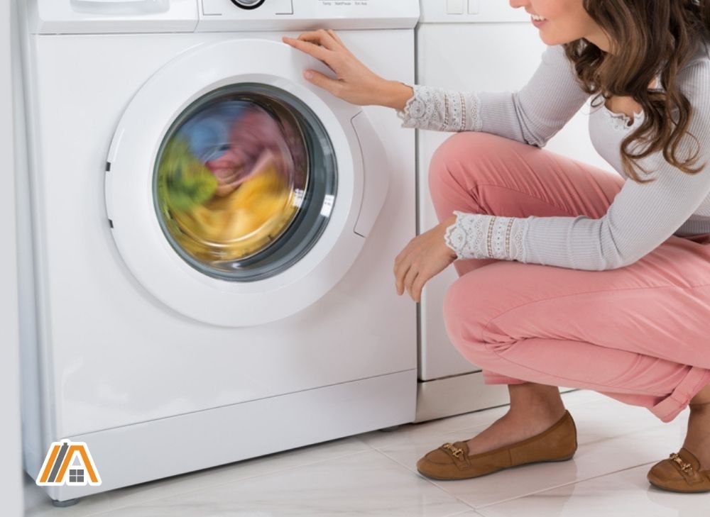 Woman washing clothes in the washer